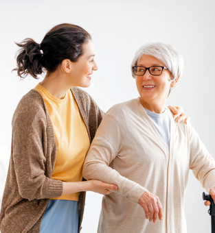 woman and elderly woman looking at each other